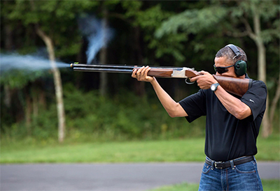Barack Obama shooting a shotgun