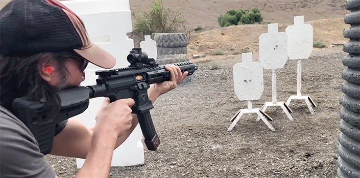 Keanu Reeves at a gun range