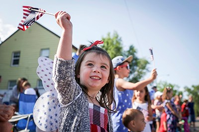 young girl waving flag